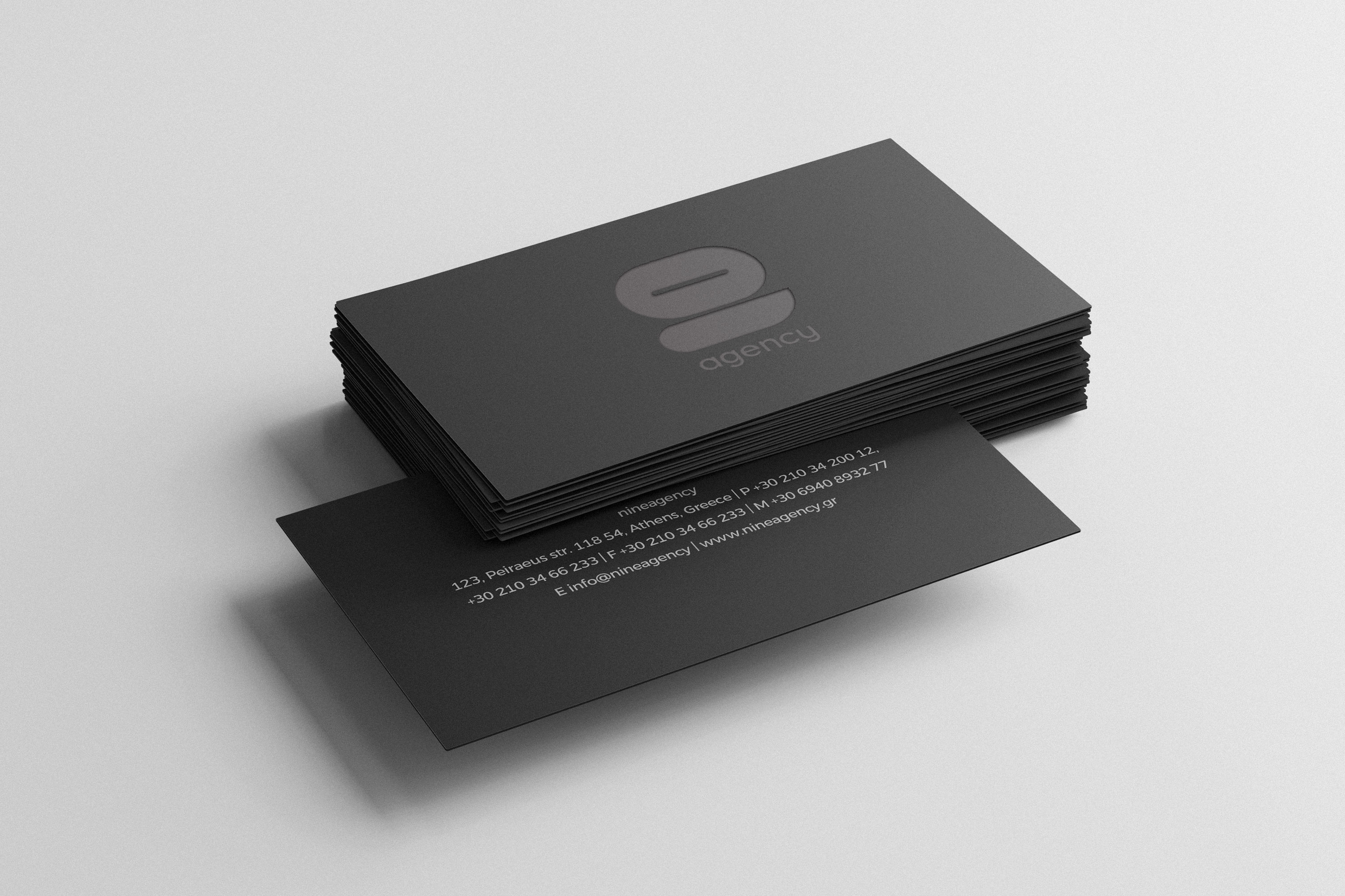 nine agency business cards design. black laminated 600gr paper with leterpress semi foil logo.