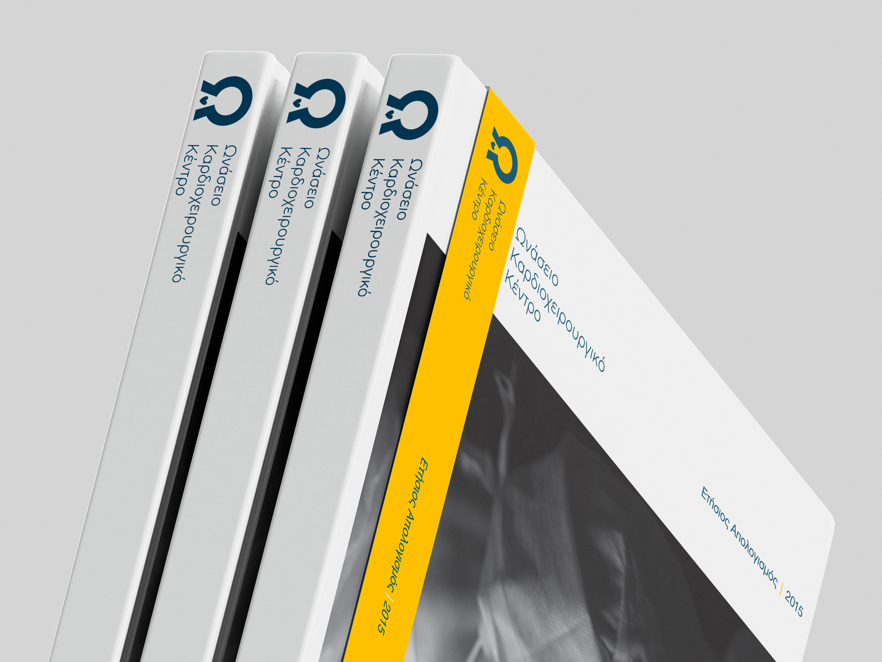 Annual report design for Onassis Cardiac Surgery Center showing printed reports and cover