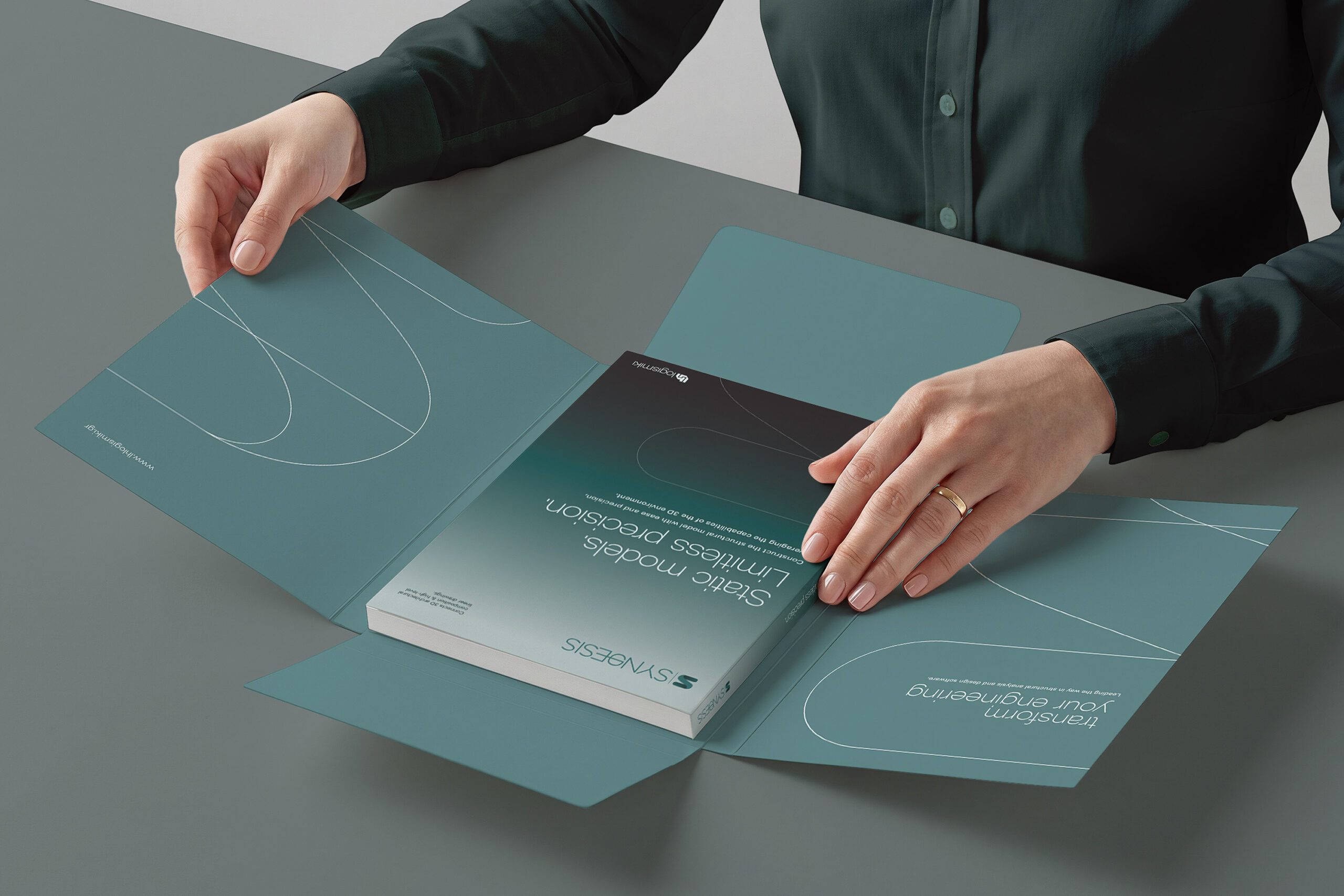 Individual displaying a dark green manual titled "LH Logismiki Synthesis" with a protective folder cover.