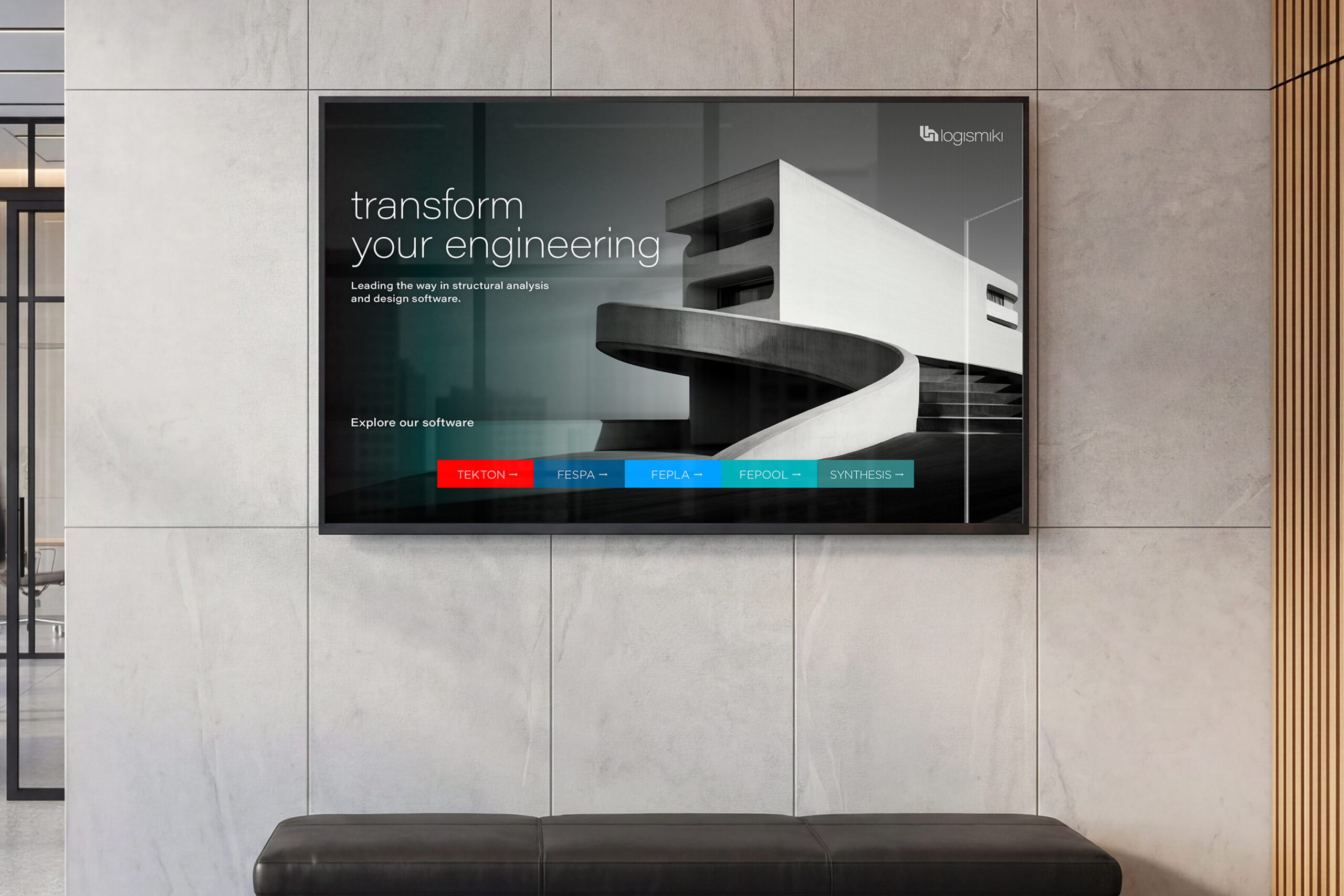 Contemporary office lobby with a prominent video display on the wall, enhancing the entrance experience.