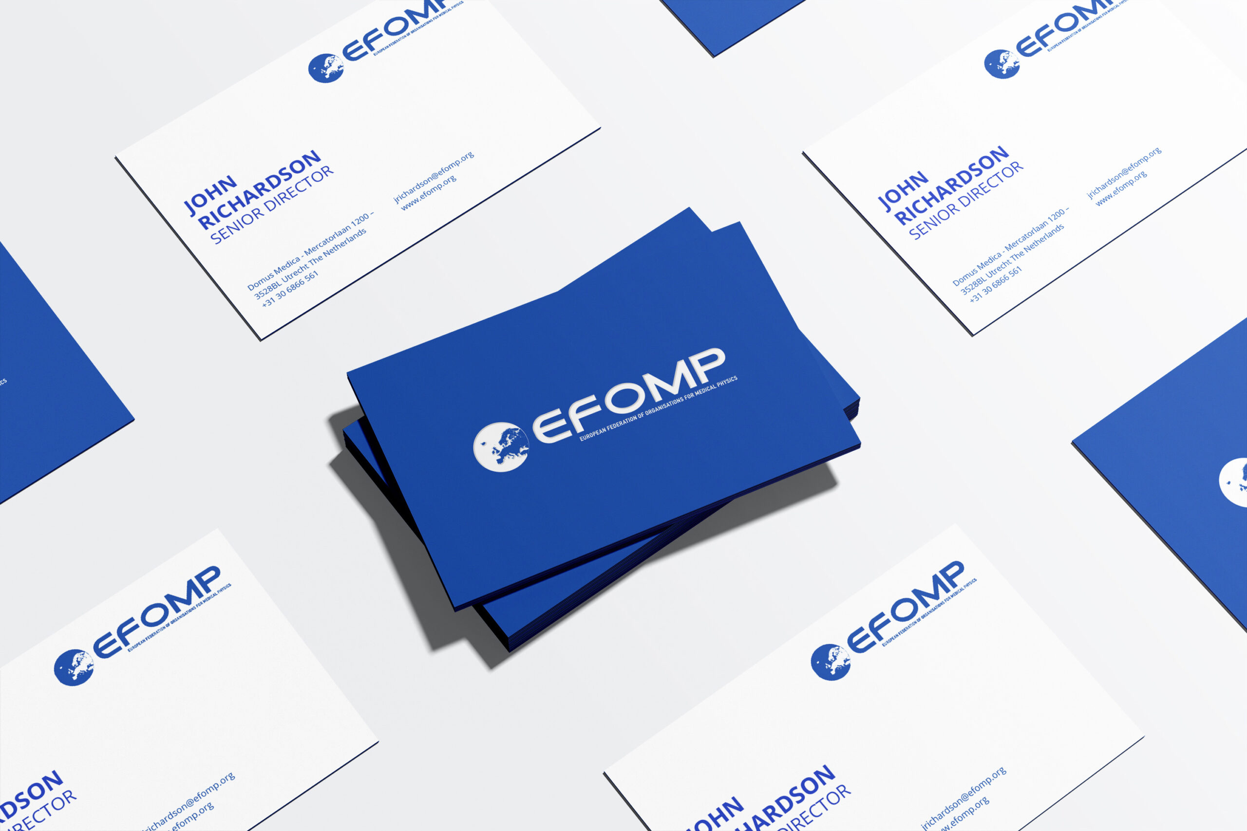 FOMP business cards arranged neatly, prominently featuring the logo and relevant details for networking purposes.