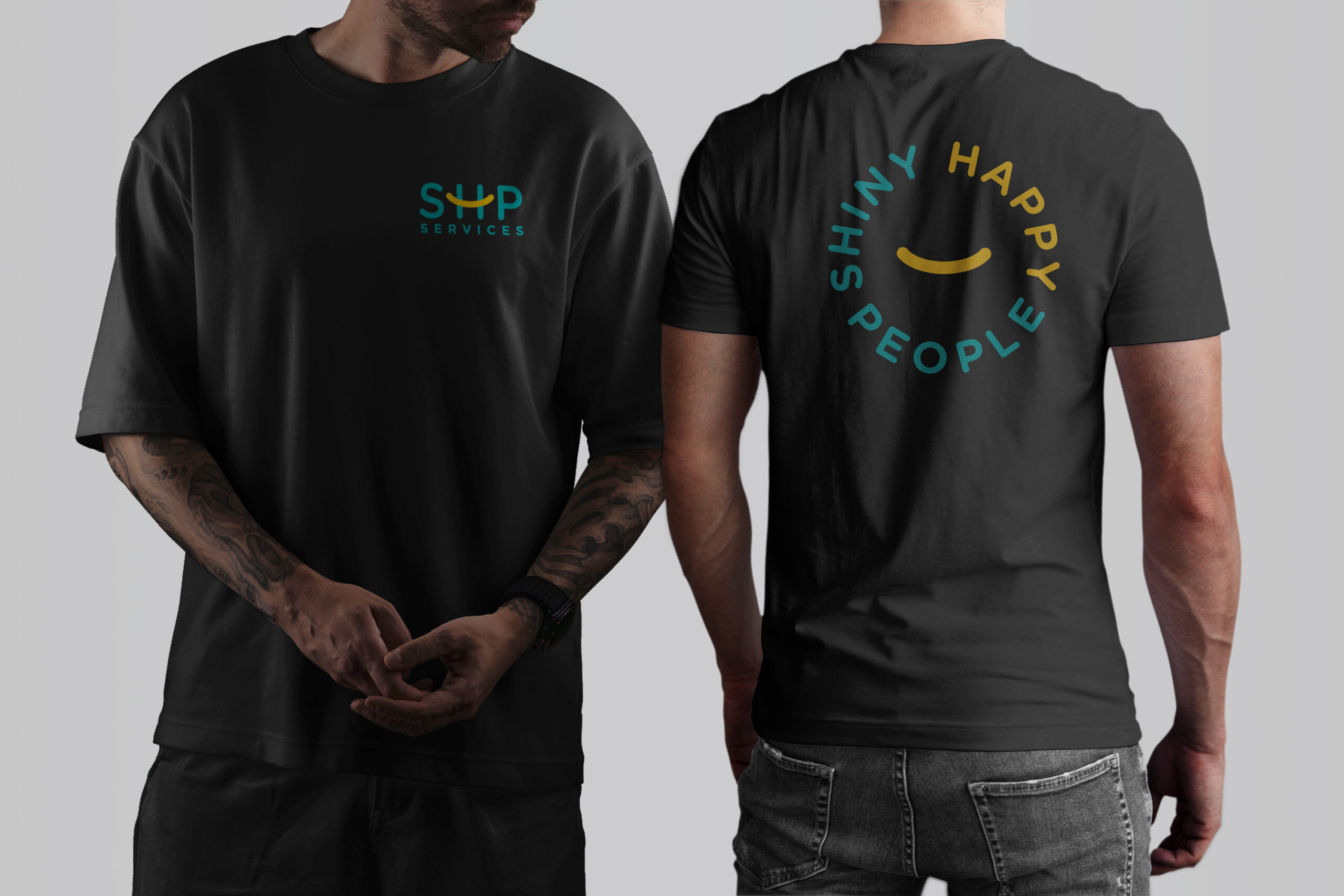 Two men dressed in black t-shirts that display "Survival Happy People," highlighting the SHP branding.