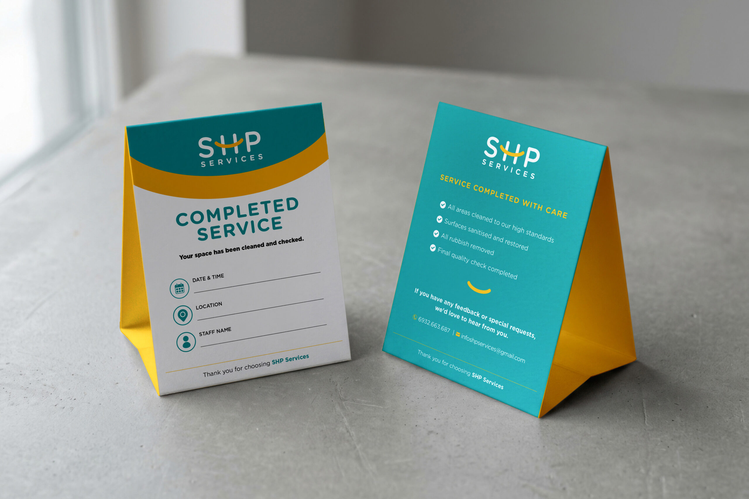 Table tent featuring a yellow and blue design, indicating cleaning services completed.