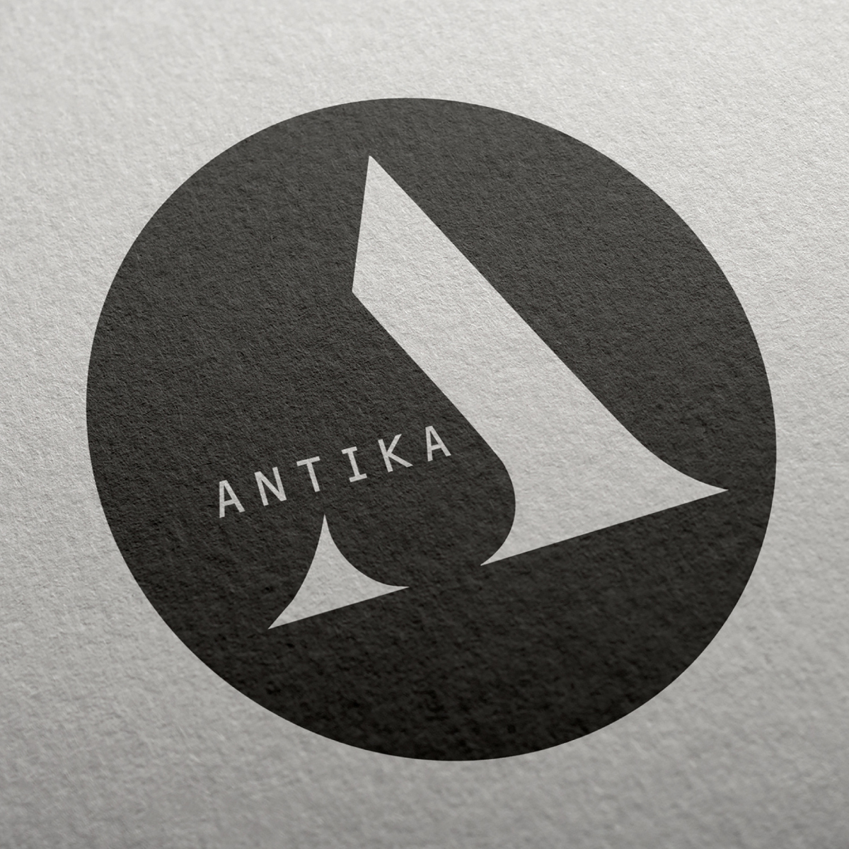 Logo of Antika, showcasing a sleek and contemporary design with distinctive lettering.