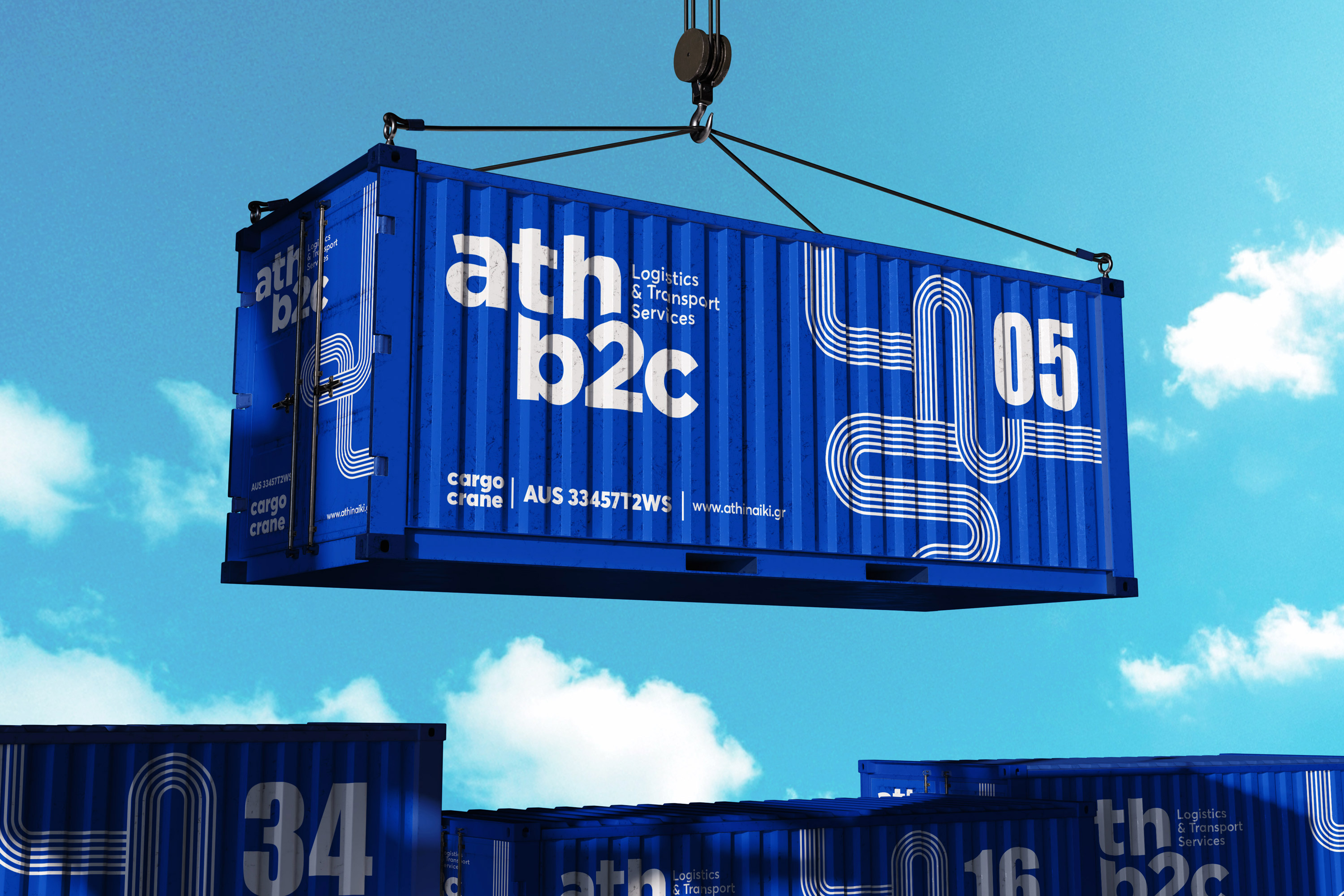 A crane lifts a shipping container featuring a blue logo, showcasing logistics operations at a shipping facility.