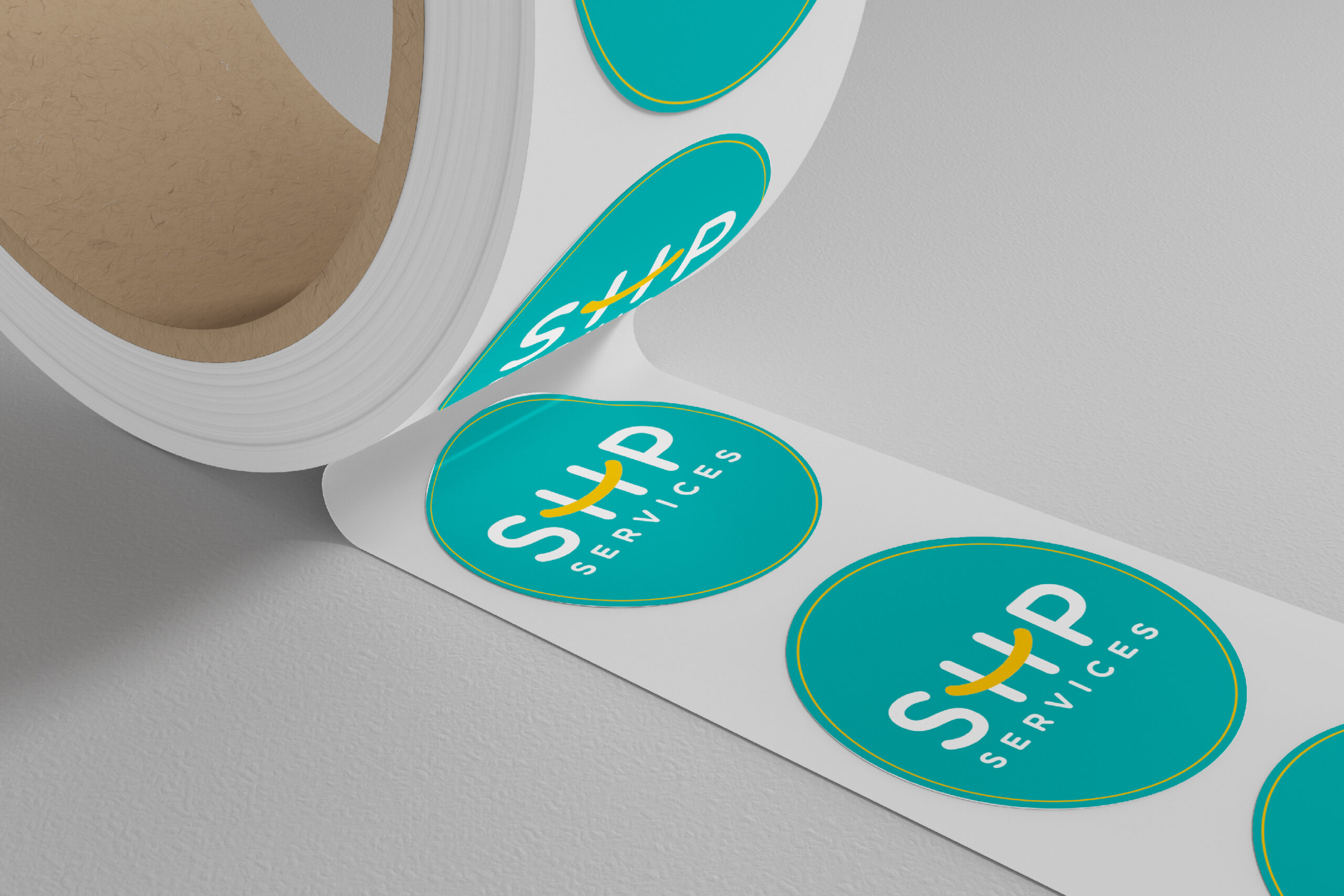 Close-up of a roll of tape with a colorful round sticker attached, highlighting its texture and shape.